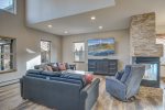 The spacious and comfortable living room offers plenty of natural light and an open floor plan